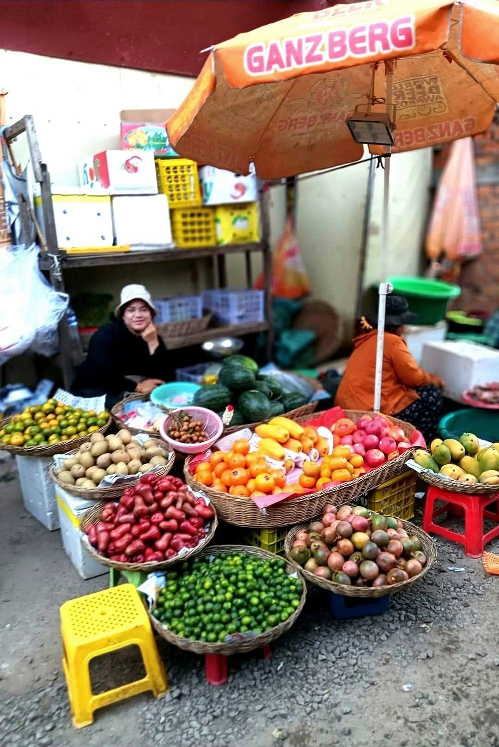 A friendly fruit seller at a Cambodian market